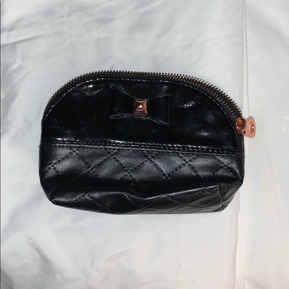 4in x 6in black makeup bag with gold accents